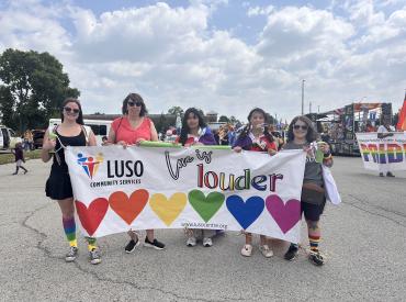 people holding pride banner